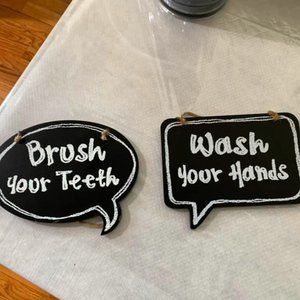 A set of 2 Black/White Chalk Bathroom Signs - Hobby Lobby